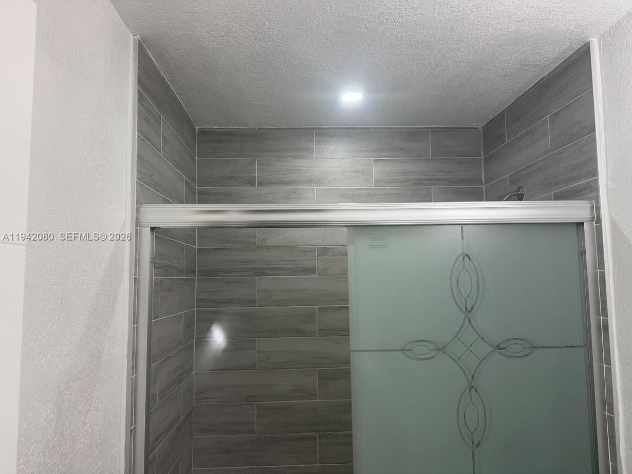 412 West 15th Street Hialeah, FL 33010 - Photo 22 of 49 a refrigerator in a bathroom