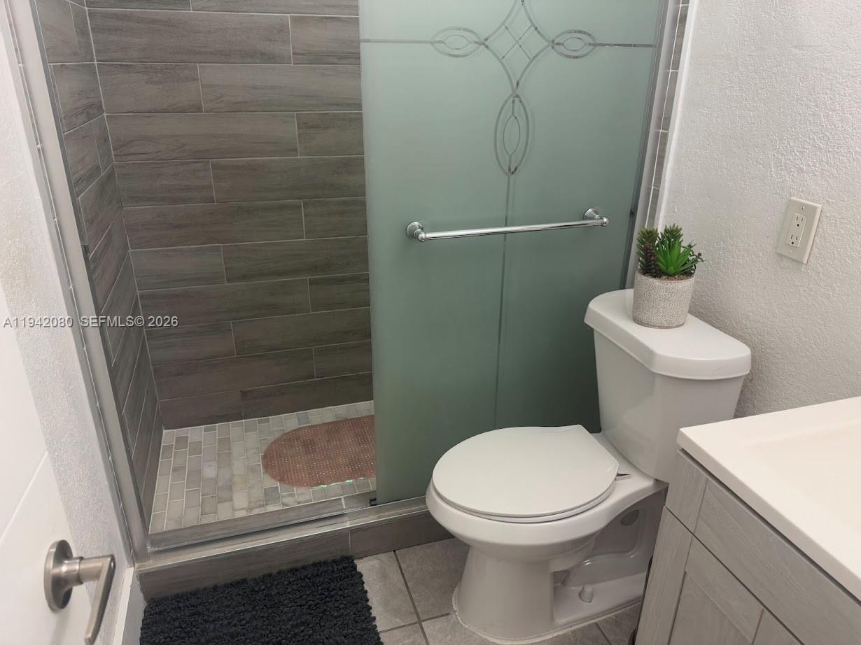 412 West 15th Street Hialeah, FL 33010 - Photo 24 of 49 a bathroom with a toilet and a shower