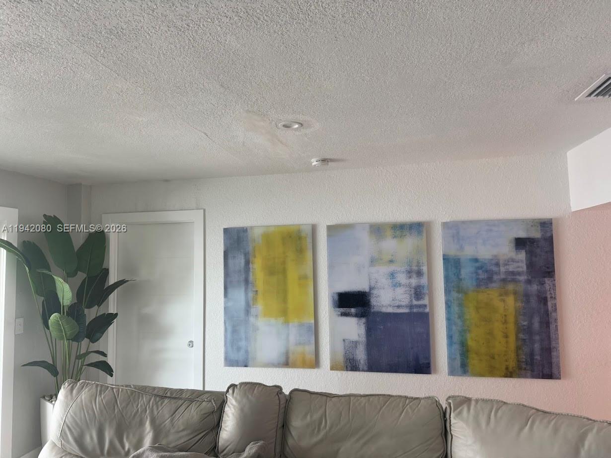 412 West 15th Street Hialeah, FL 33010 - Photo 32 of 49 a living room with furniture and a potted plant