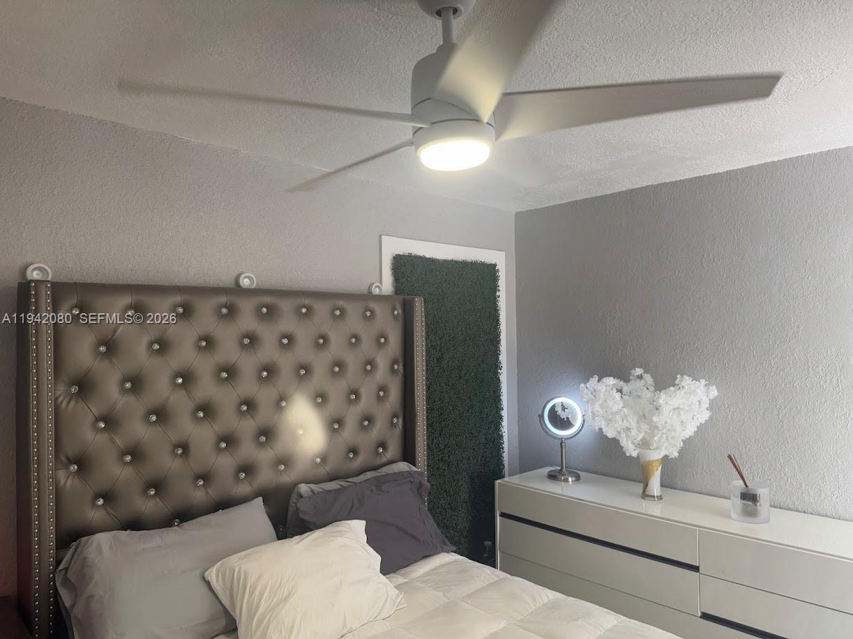 412 West 15th Street Hialeah, FL 33010 - Photo 36 of 49 a living room with furniture and a chandelier