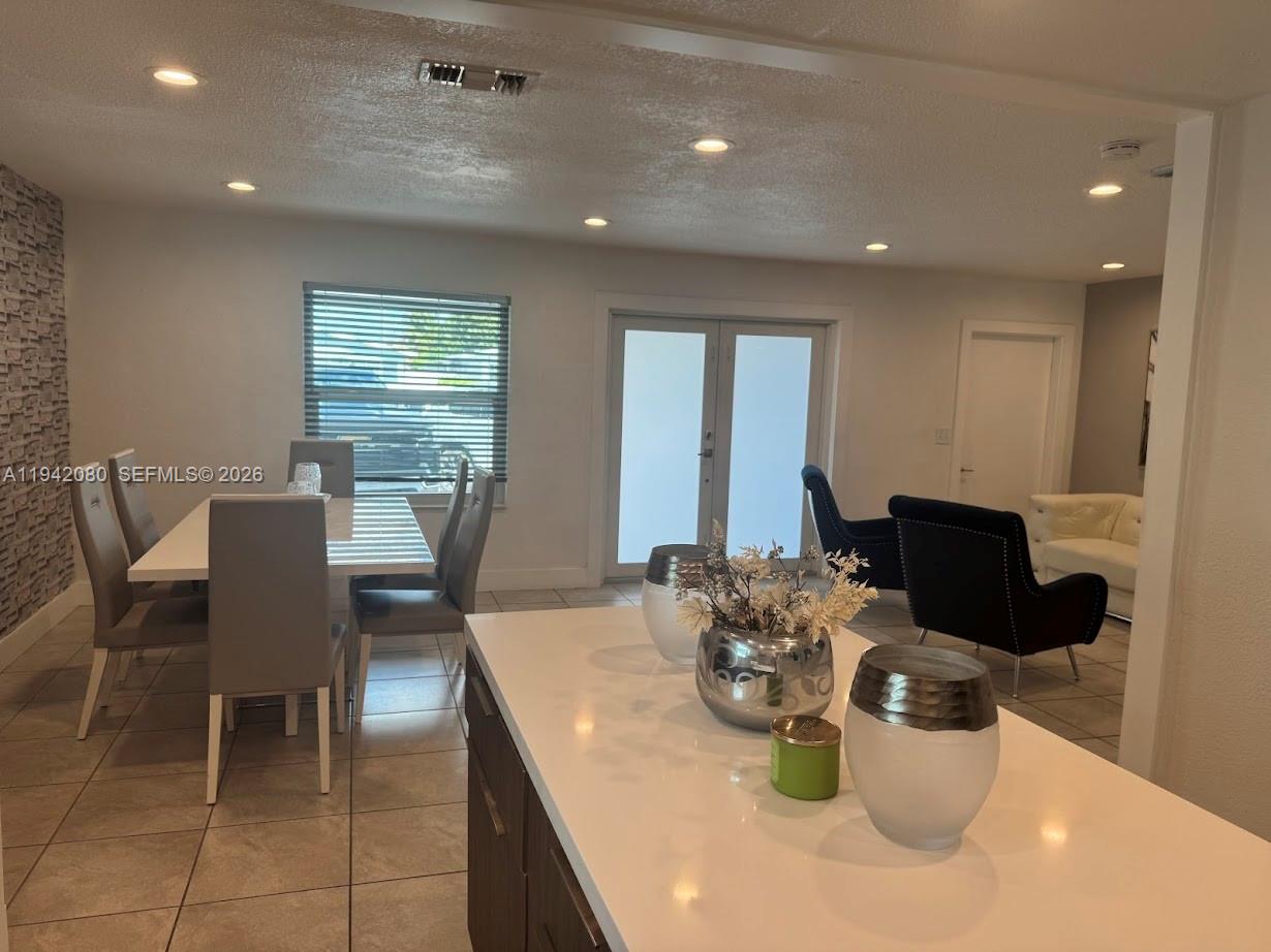 412 West 15th Street Hialeah, FL 33010 - Photo 8 of 48 a dining room with furniture and wooden floor
