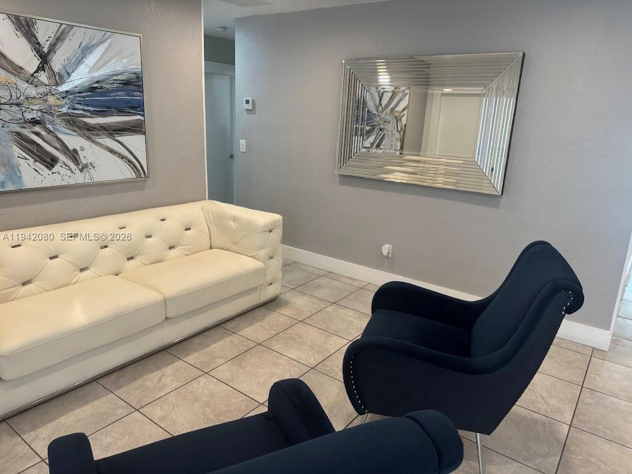 412 West 15th Street Hialeah, FL 33010 - Photo 9 of 48 a living room with furniture and a couch