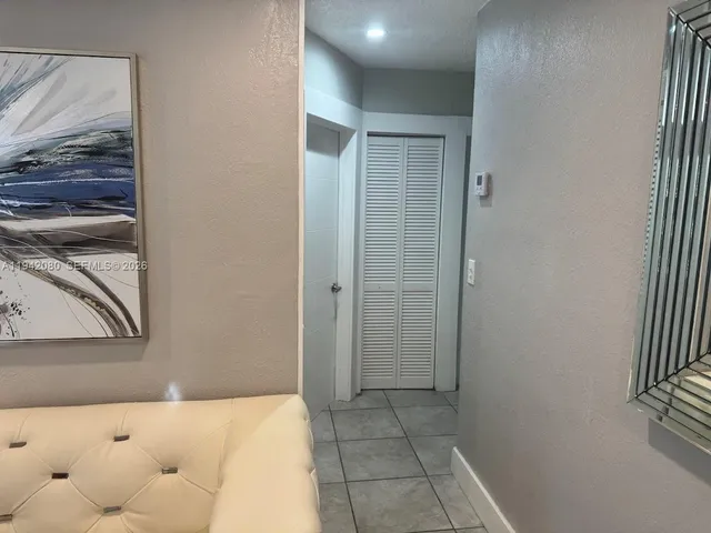 a kitchen with a sink cabinets and stainless steel appliances