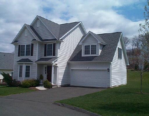 121 Logging Trail Road, Unit 121 Danbury, CT 06811 - Photo 1 of 1 a front view of a house with garden