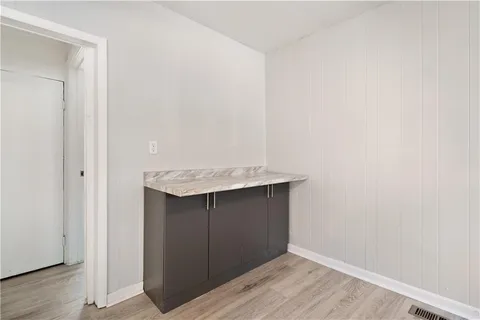 an empty room with wooden floor