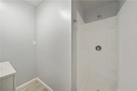 a bedroom with bed and window