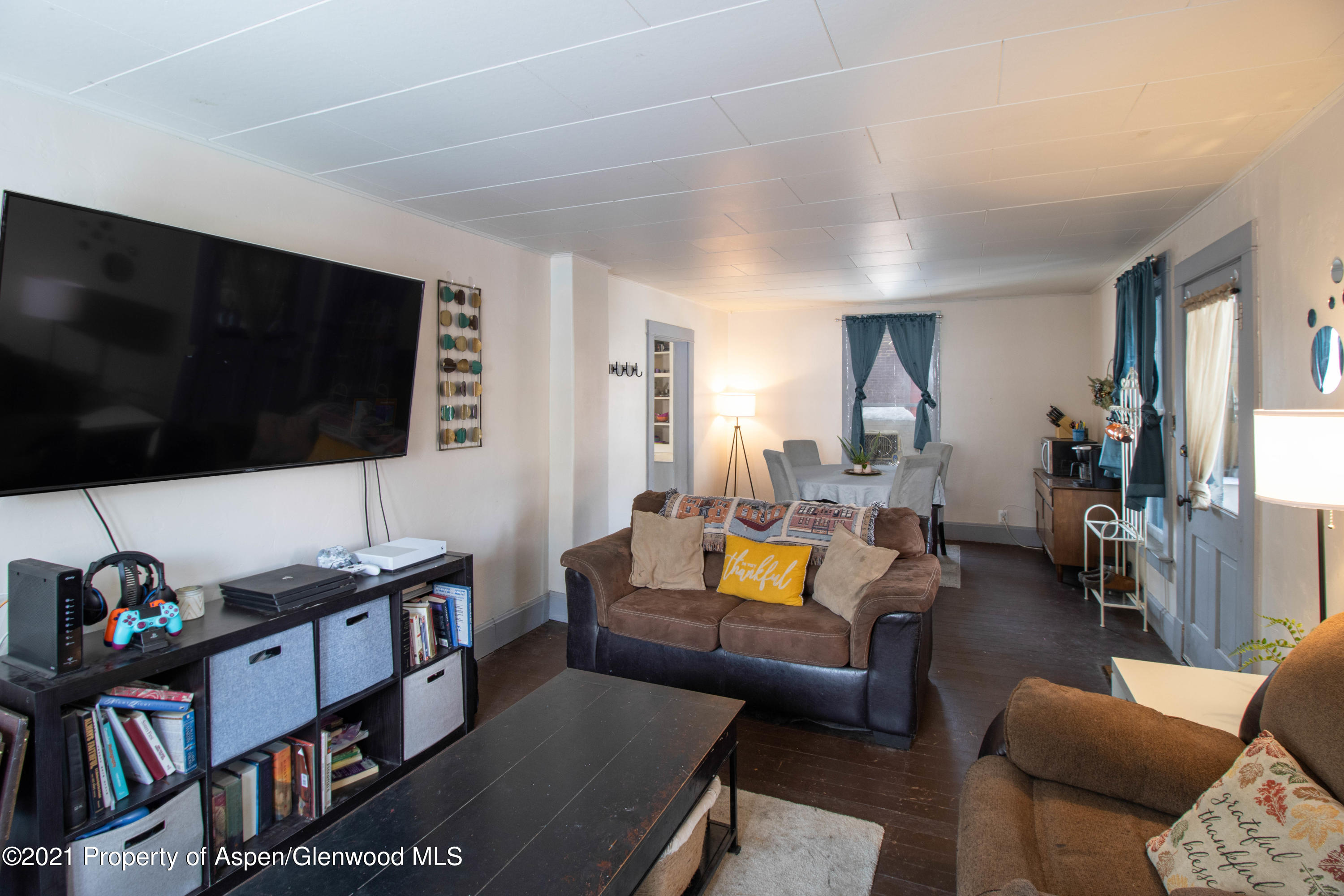 211 East 2nd Street Rifle, CO 81650 - Photo 4 of 15 a living room with furniture and a flat screen tv