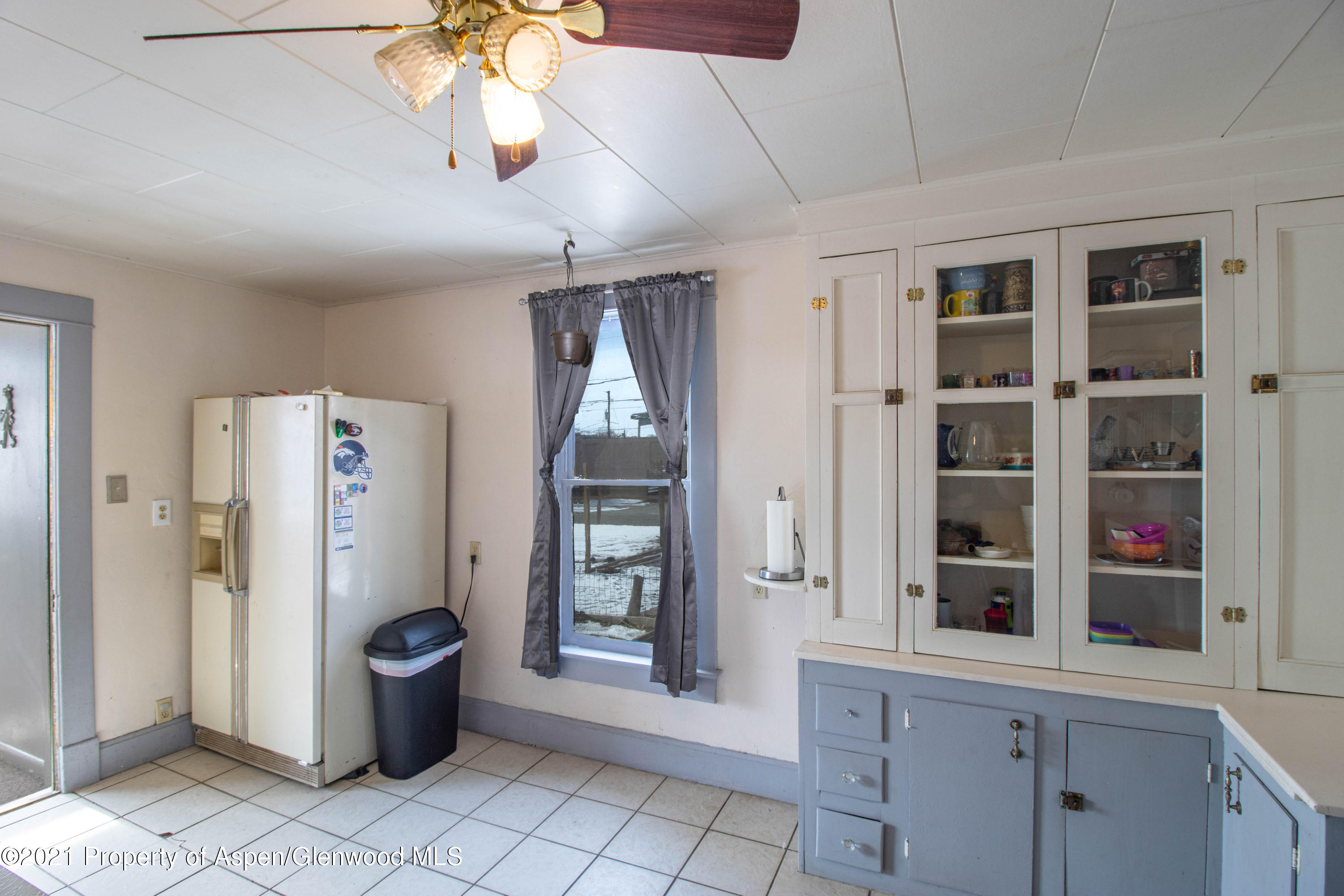 211 East 2nd Street Rifle, CO 81650 - Photo 6 of 15 a view of an entryway with a cabinet and a potted plant