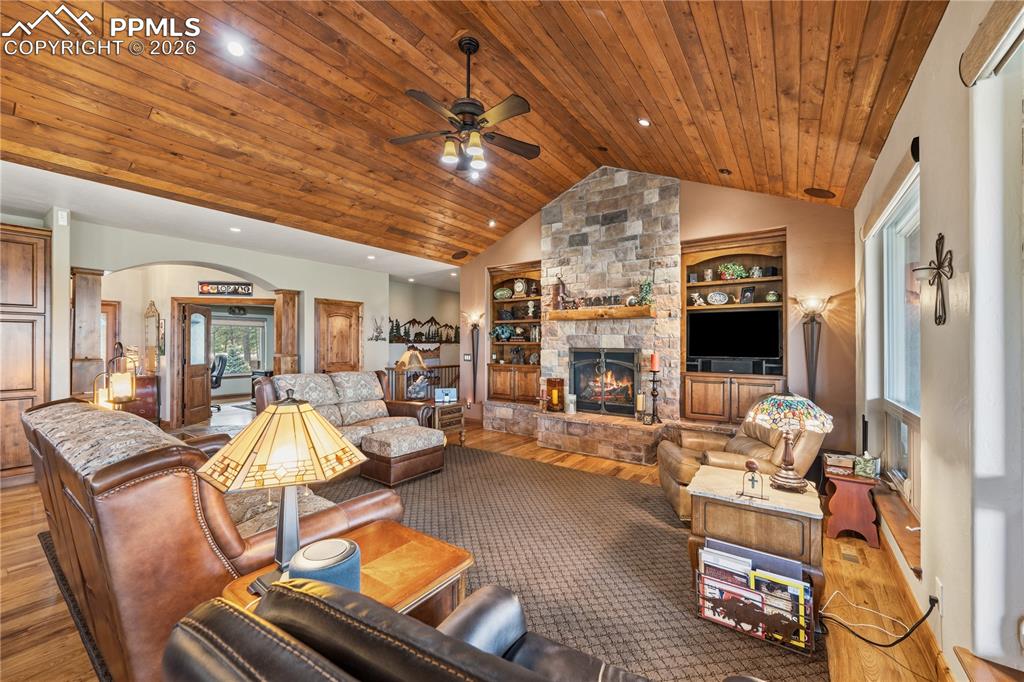 18890 Wing Tip Road Colorado Springs, CO 80908 - Photo 12 of 48 a living room with furniture and a flat screen tv