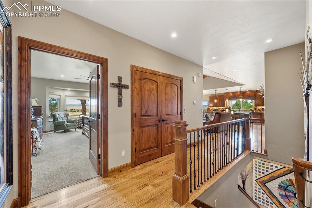 18890 Wing Tip Road Colorado Springs, CO 80908 - Photo 14 of 48 a view of a hallway with livingroom and furniture