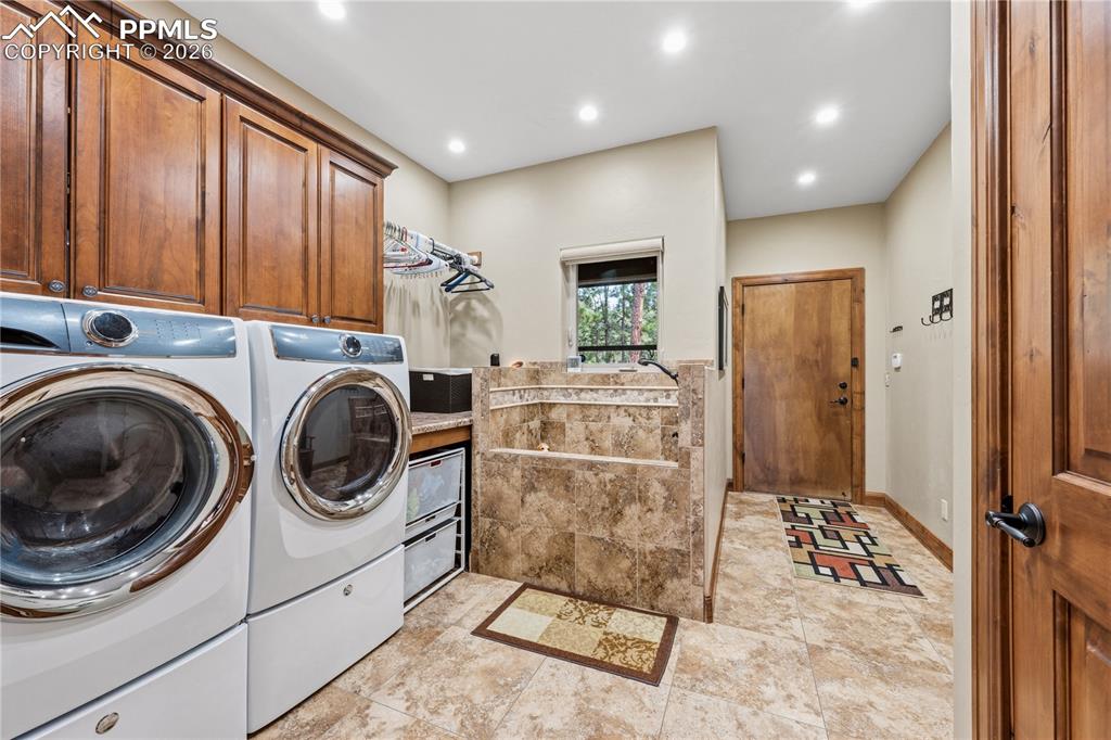 18890 Wing Tip Road Colorado Springs, CO 80908 - Photo 22 of 48 a kitchen with refrigerator and cabinets