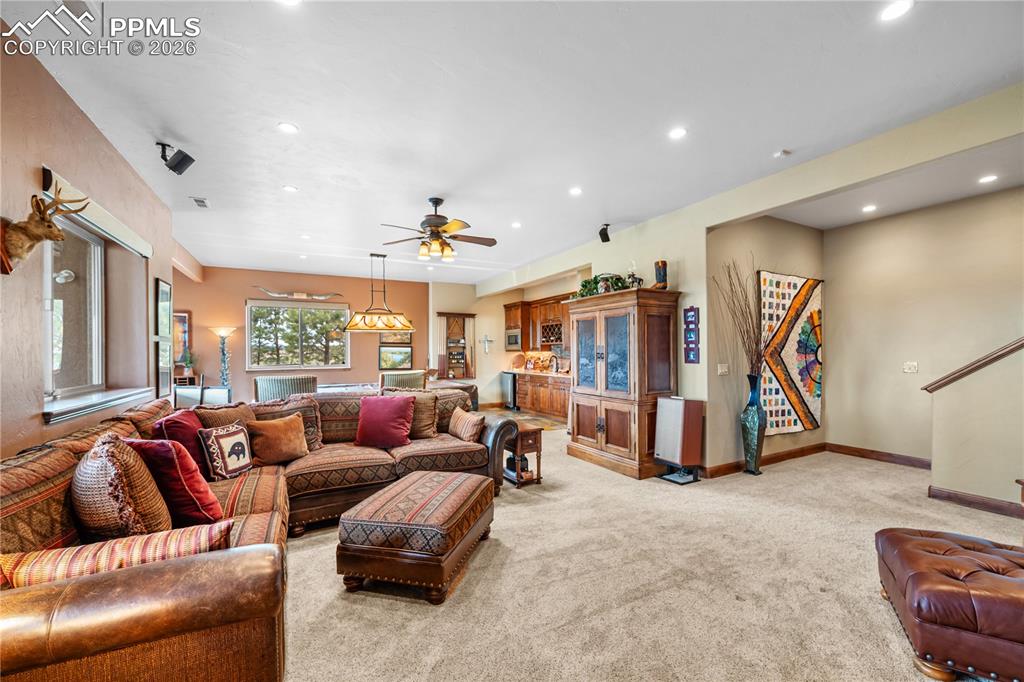 18890 Wing Tip Road Colorado Springs, CO 80908 - Photo 23 of 48 a living room with furniture and a gym