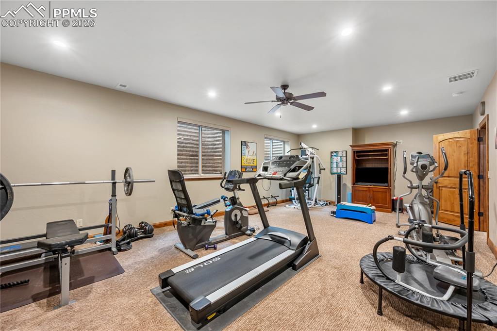 18890 Wing Tip Road Colorado Springs, CO 80908 - Photo 34 of 48 a view of a room with gym equipment