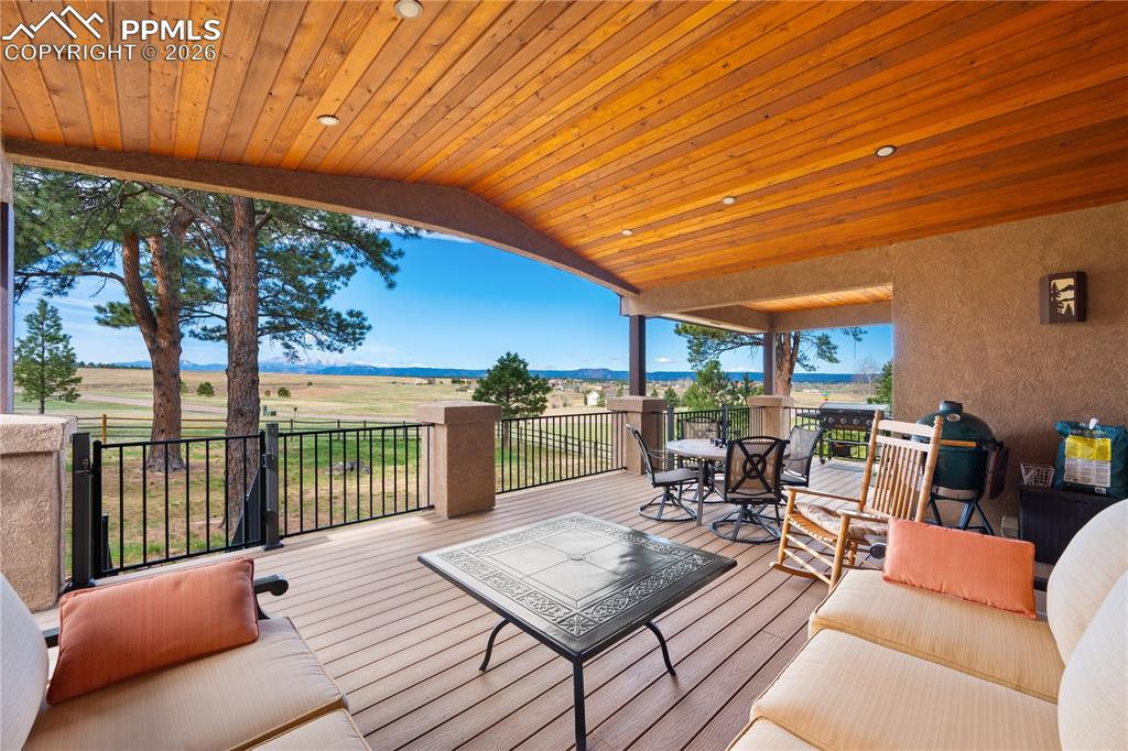 18890 Wing Tip Road Colorado Springs, CO 80908 - Photo 36 of 48 a view of a patio with couches table and chairs