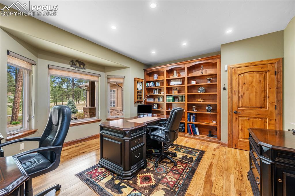 18890 Wing Tip Road Colorado Springs, CO 80908 - Photo 7 of 48 a view of a workspace with furniture and a window