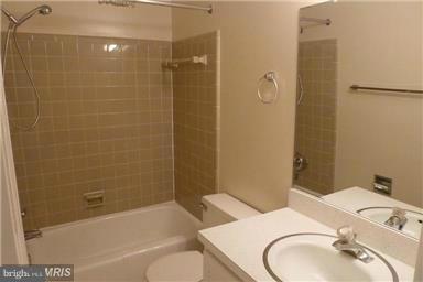 6735 Towne Lane Road McLean, VA 22101 - Photo 5 of 24 a bathroom with a sink toilet and shower