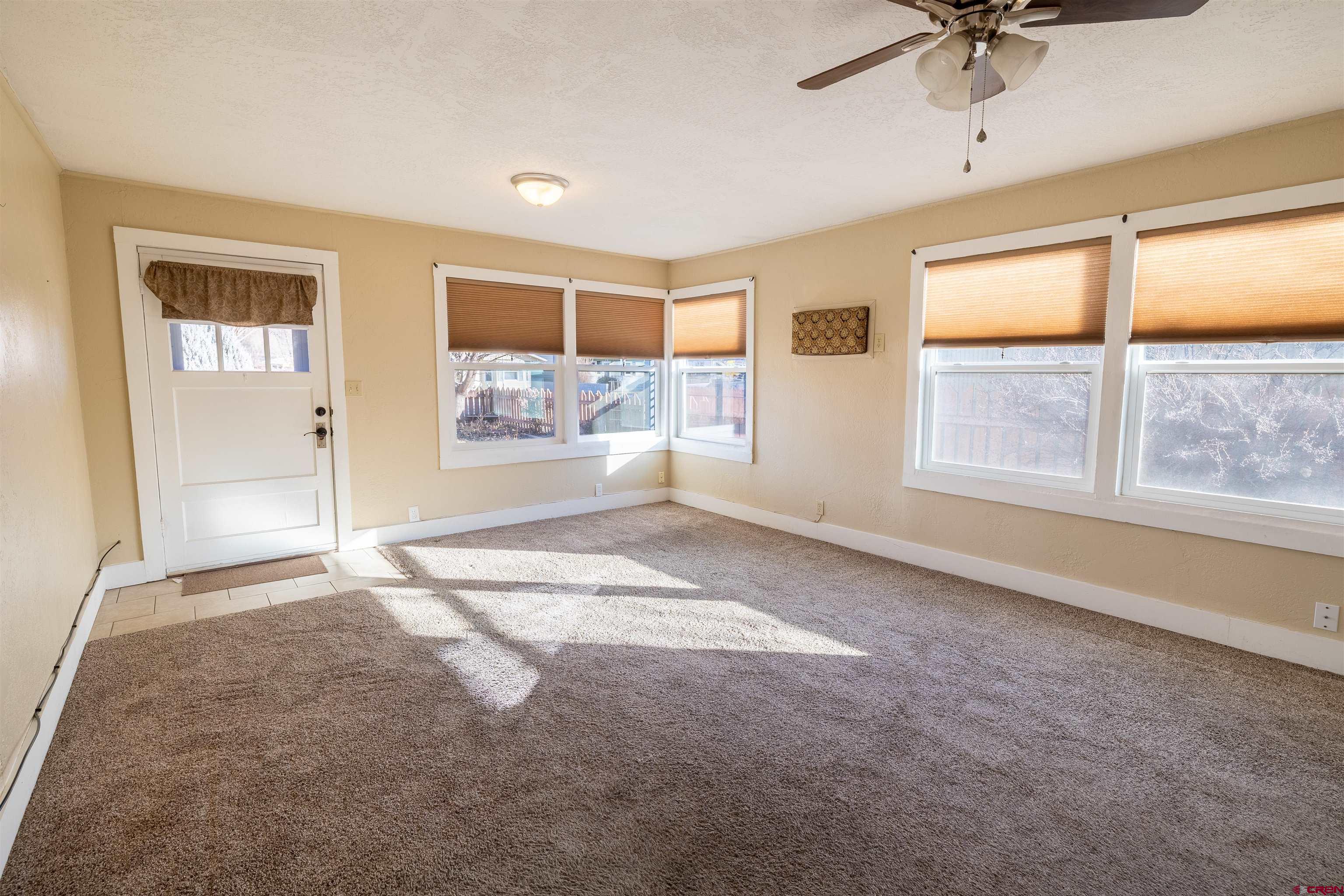 1015 Howard Street Delta, CO 81416 - Photo 5 of 22 a view of an empty room with a window