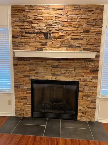 a stove top oven sitting inside of a kitchen