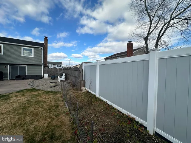a view of hallway with wooden floor