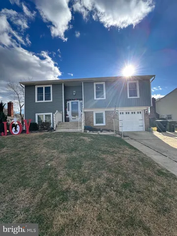 a view of a house with backyard porch and sitting area