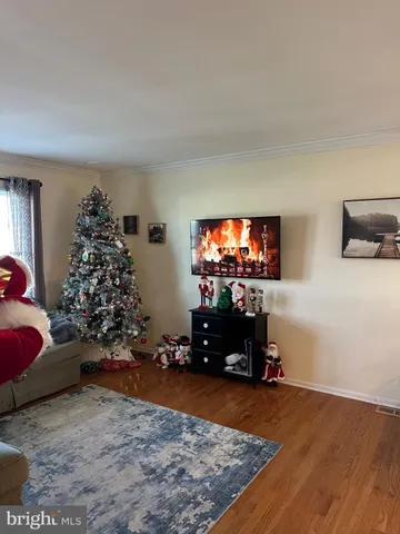 a bed sitting in a bedroom and night stand