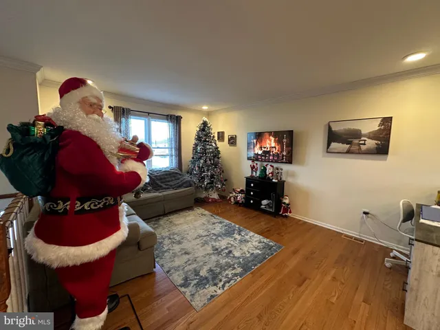 a kitchen with stainless steel appliances granite countertop a refrigerator a stove a sink a microwave and island