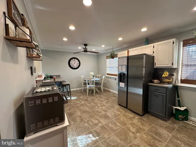 a bathroom with a toilet and a shower curtain