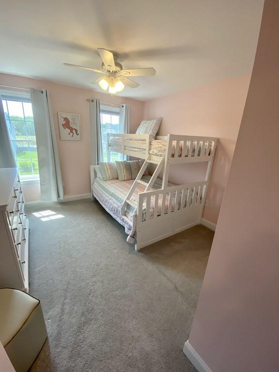 84 Old Pasture Road Dracut, MA 01826 - Photo 17 of 37 a living room with furniture and a chandelier