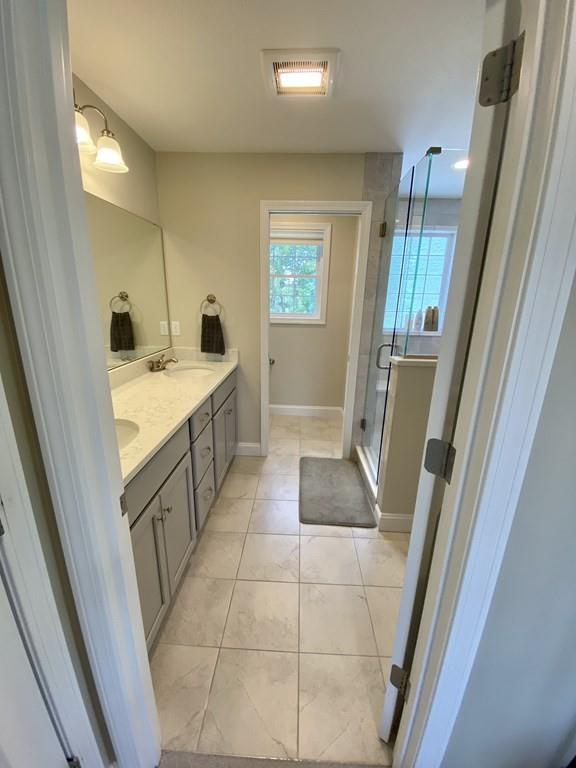 84 Old Pasture Road Dracut, MA 01826 - Photo 21 of 37 a bathroom with a sink a toilet a mirror and shower