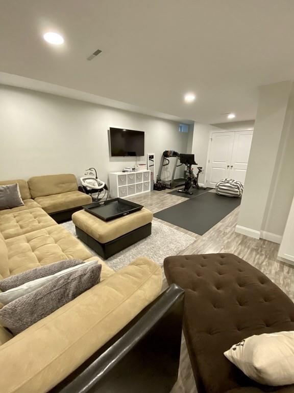 84 Old Pasture Road Dracut, MA 01826 - Photo 27 of 37 a living room with furniture and a flat screen tv