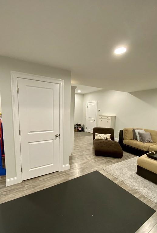 84 Old Pasture Road Dracut, MA 01826 - Photo 29 of 37 a living room with furniture and a wooden floor