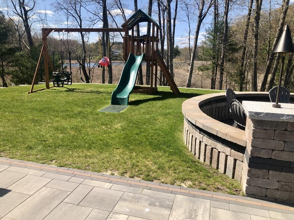 84 Old Pasture Road Dracut, MA 01826 - Photo 31 of 37 a front view of a house with a yard