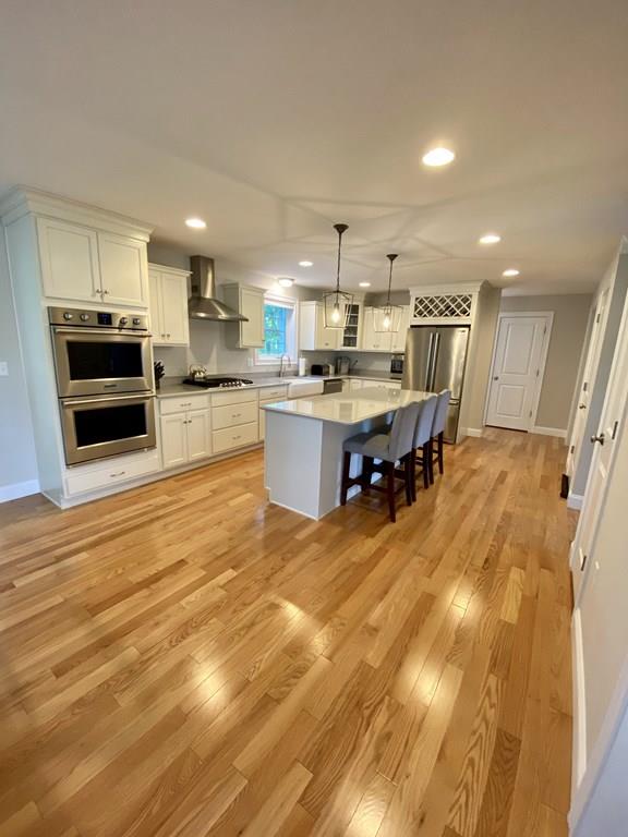 84 Old Pasture Road Dracut, MA 01826 - Photo 4 of 37 a large kitchen with lots of counter space and stainless steel appliances
