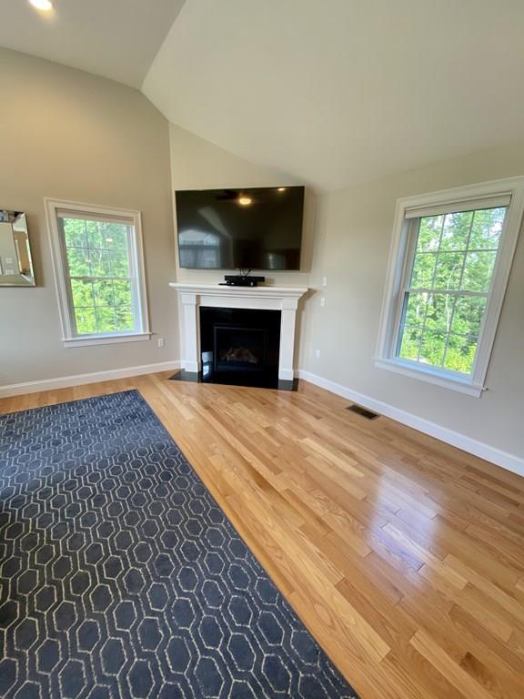84 Old Pasture Road Dracut, MA 01826 - Photo 7 of 37 an empty room with windows fireplace and a microwave