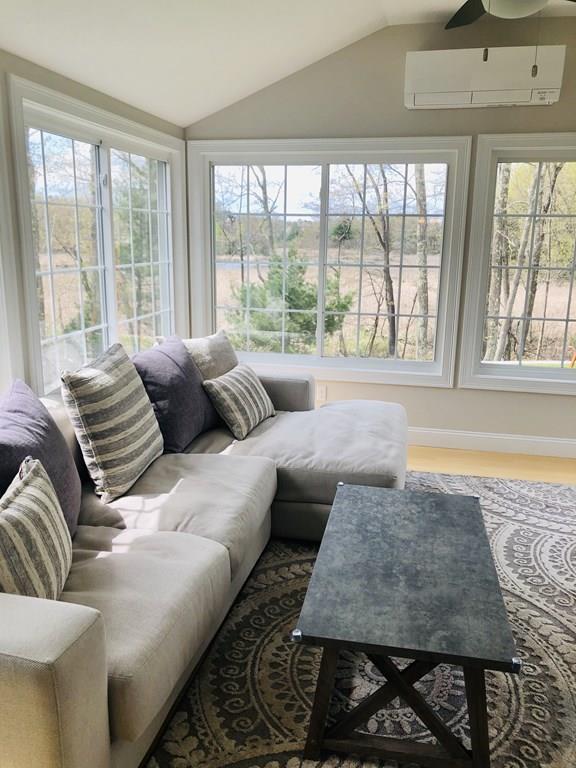 84 Old Pasture Road Dracut, MA 01826 - Photo 9 of 37 a living room with large window and a table