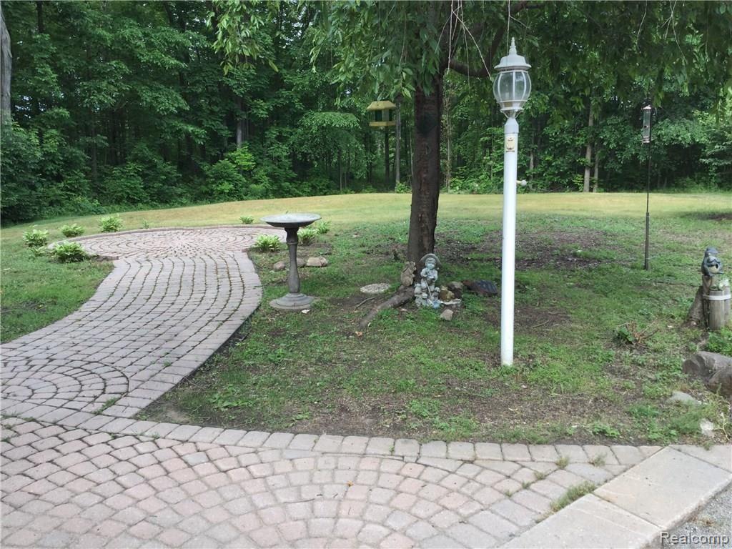 Brick walkways and nice area to bird watch in front of home.