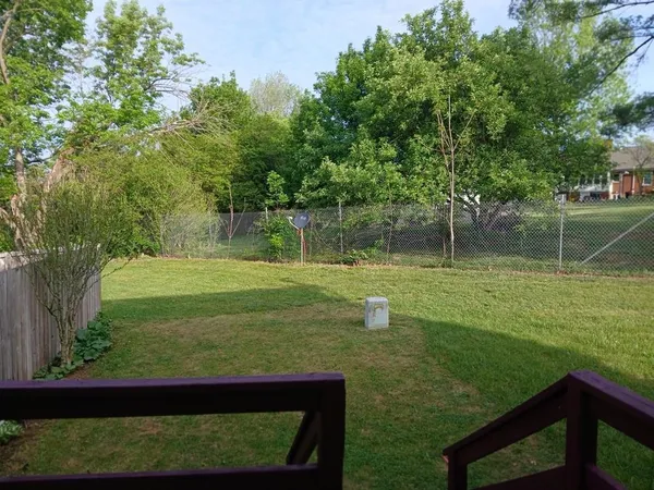 a view of a deck with a table and chairs and wooden floor