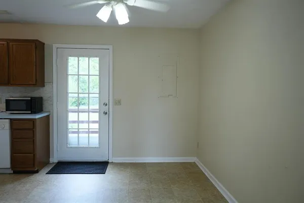 a view of staircase with white walls