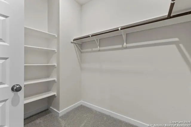 a view of an empty walk in closet