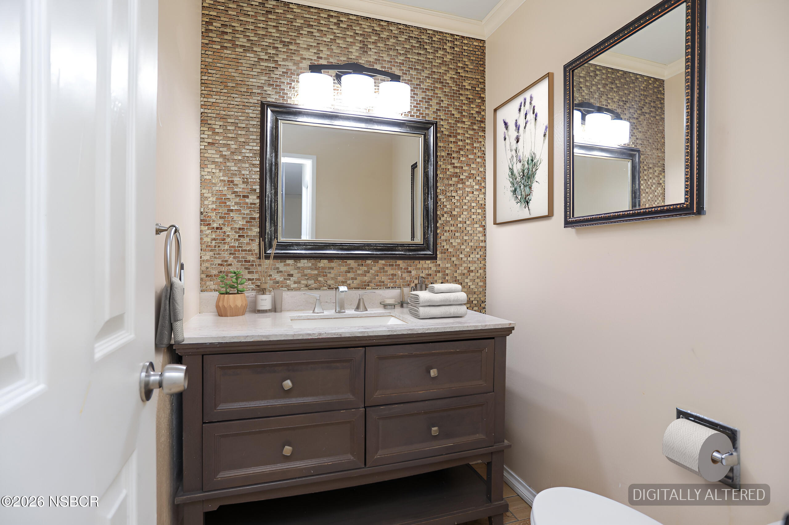 1321 North Bradley Road, Unit 14 Santa Maria, CA 93454 - Photo 11 of 30 a bathroom with a toilet sink and mirror