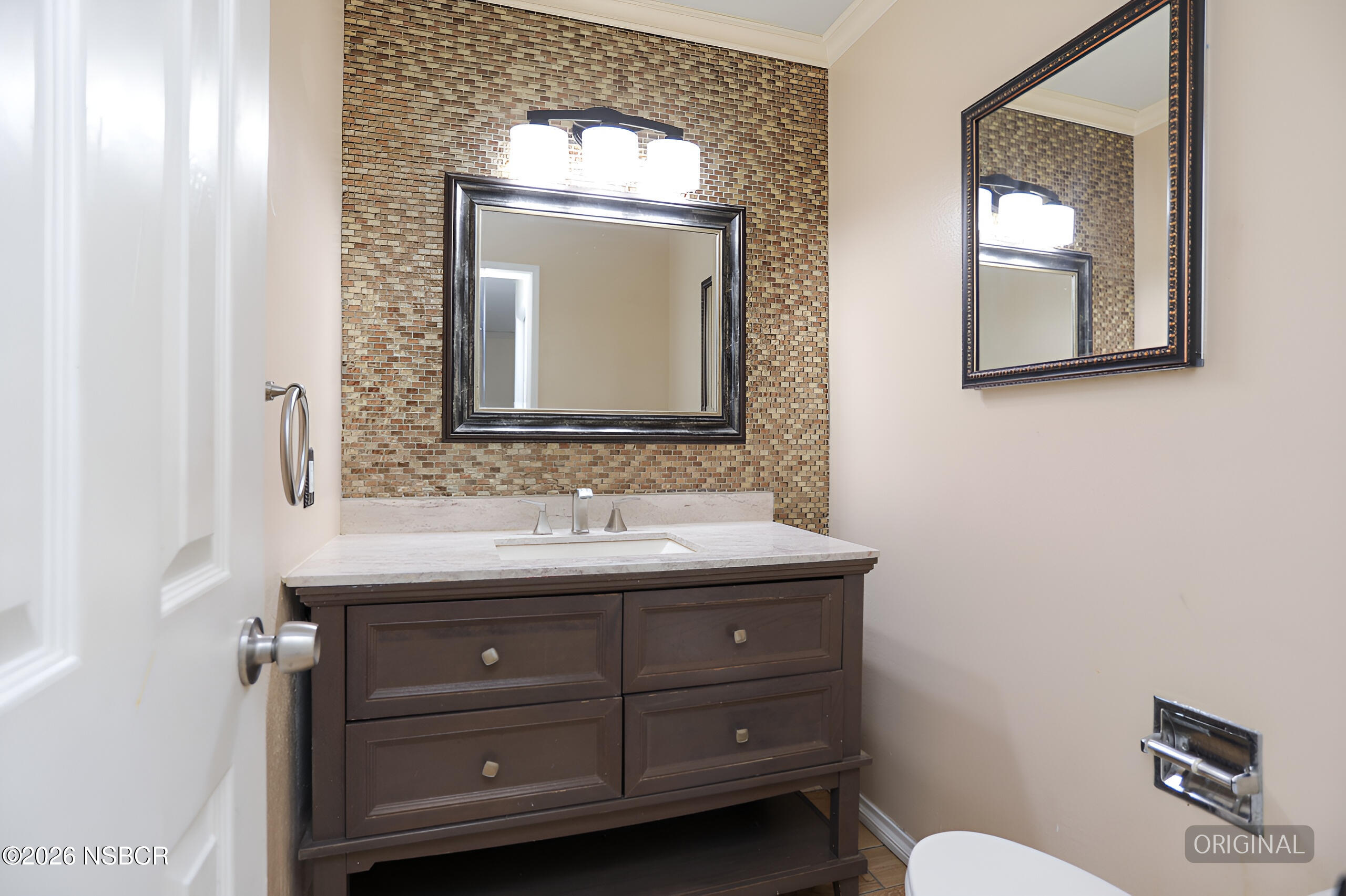 1321 North Bradley Road, Unit 14 Santa Maria, CA 93454 - Photo 12 of 30 a bathroom with a toilet sink and mirror
