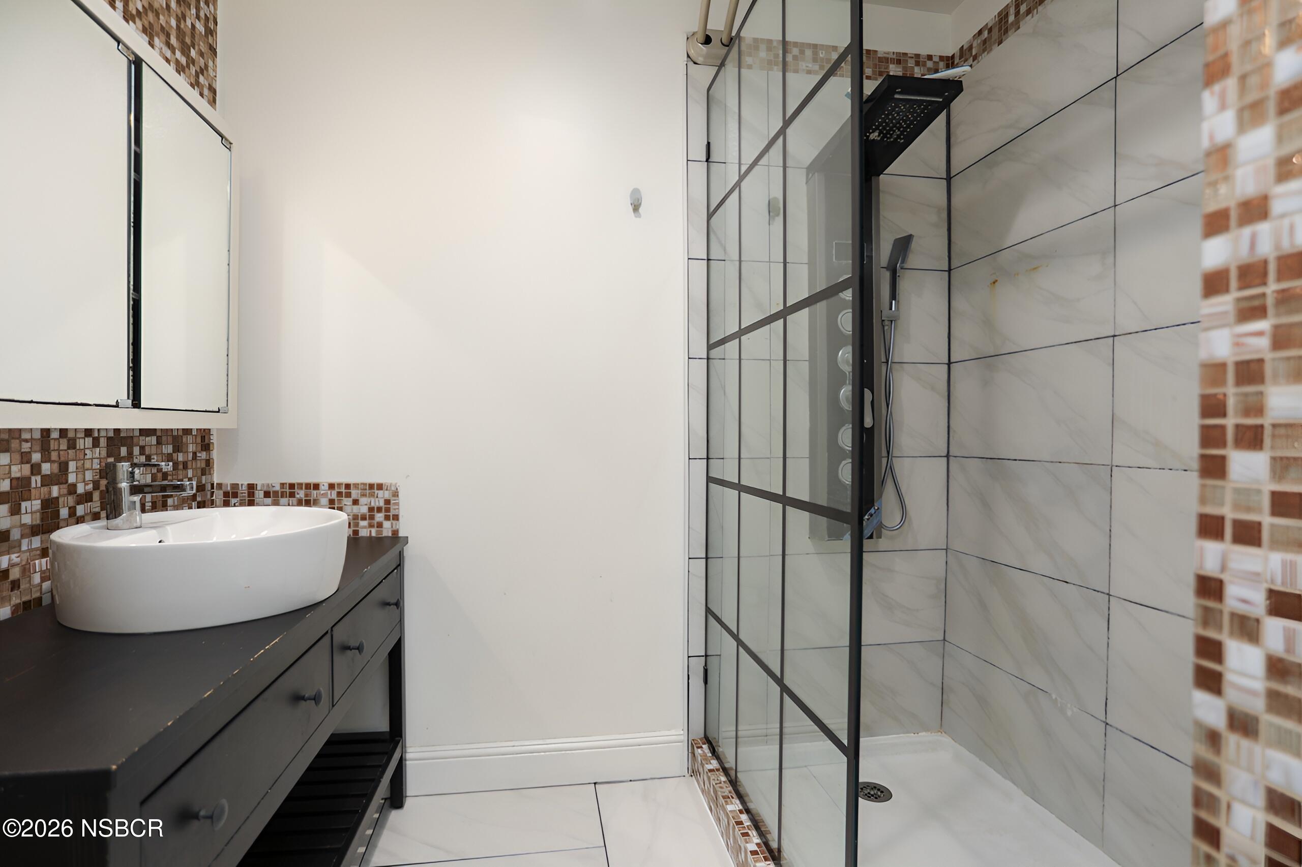 1321 North Bradley Road, Unit 14 Santa Maria, CA 93454 - Photo 17 of 30 a bathroom with a sink and a mirror