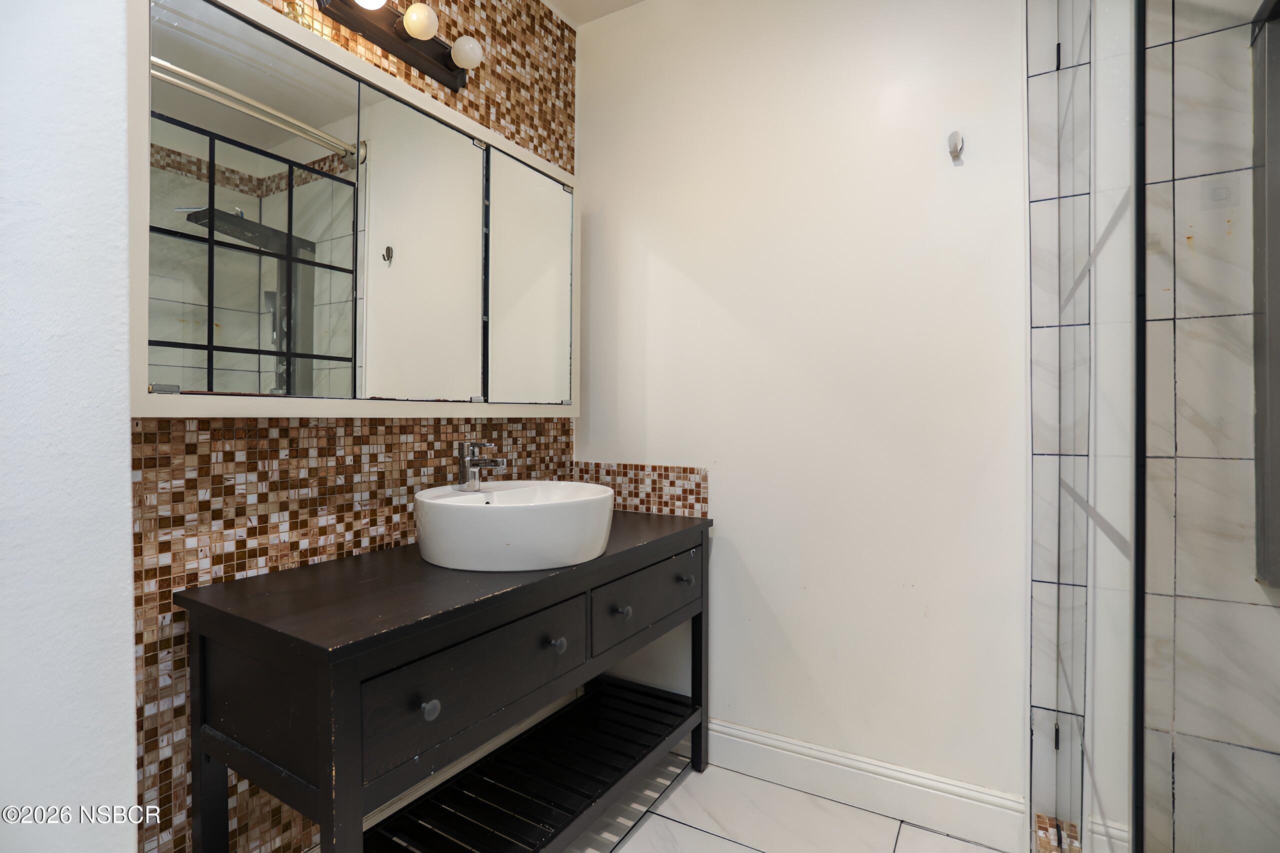 1321 North Bradley Road, Unit 14 Santa Maria, CA 93454 - Photo 18 of 30 a bathroom with a sink and a mirror