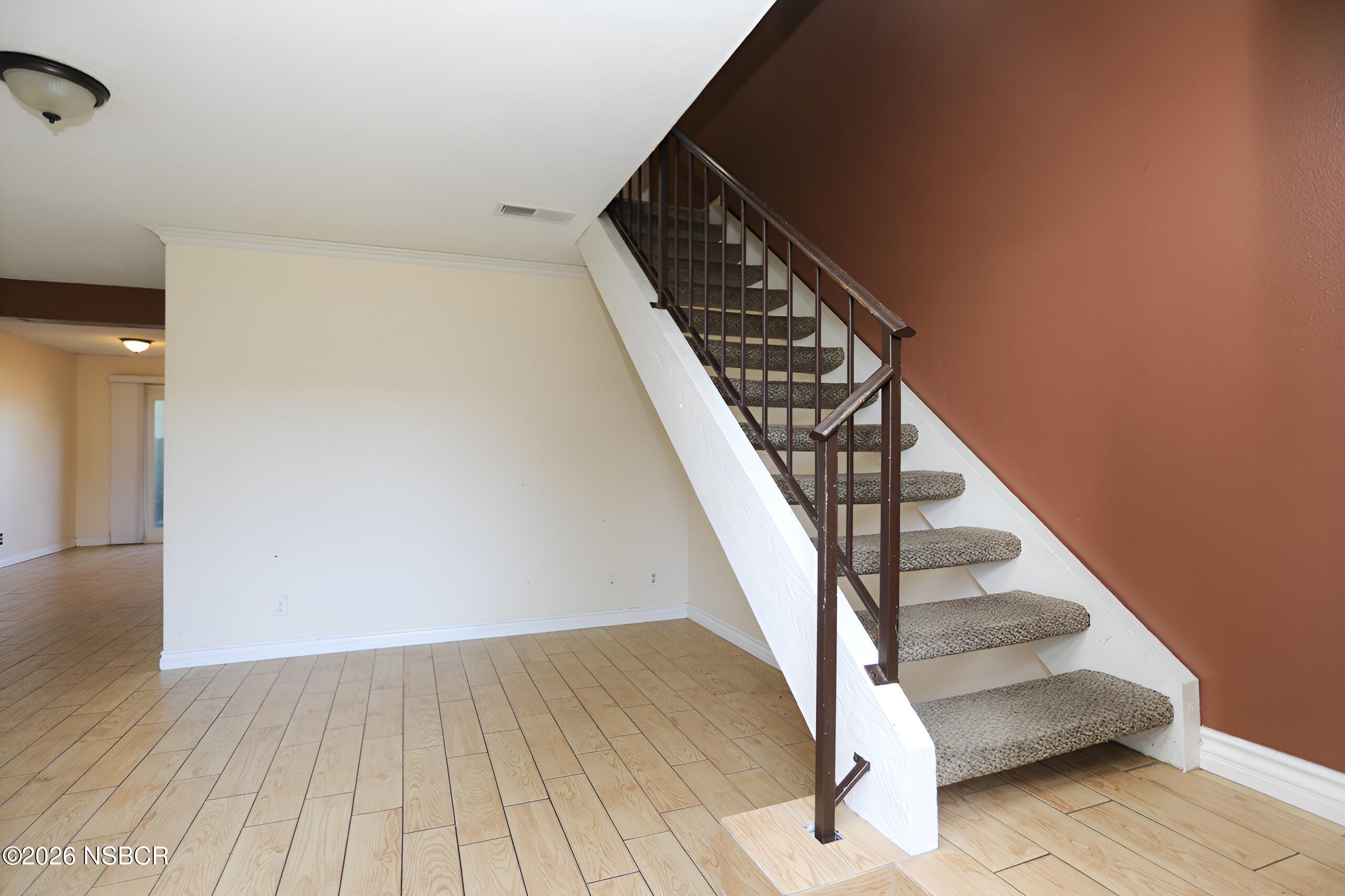 1321 North Bradley Road, Unit 14 Santa Maria, CA 93454 - Photo 2 of 30 a view of entryway and hall with wooden floor