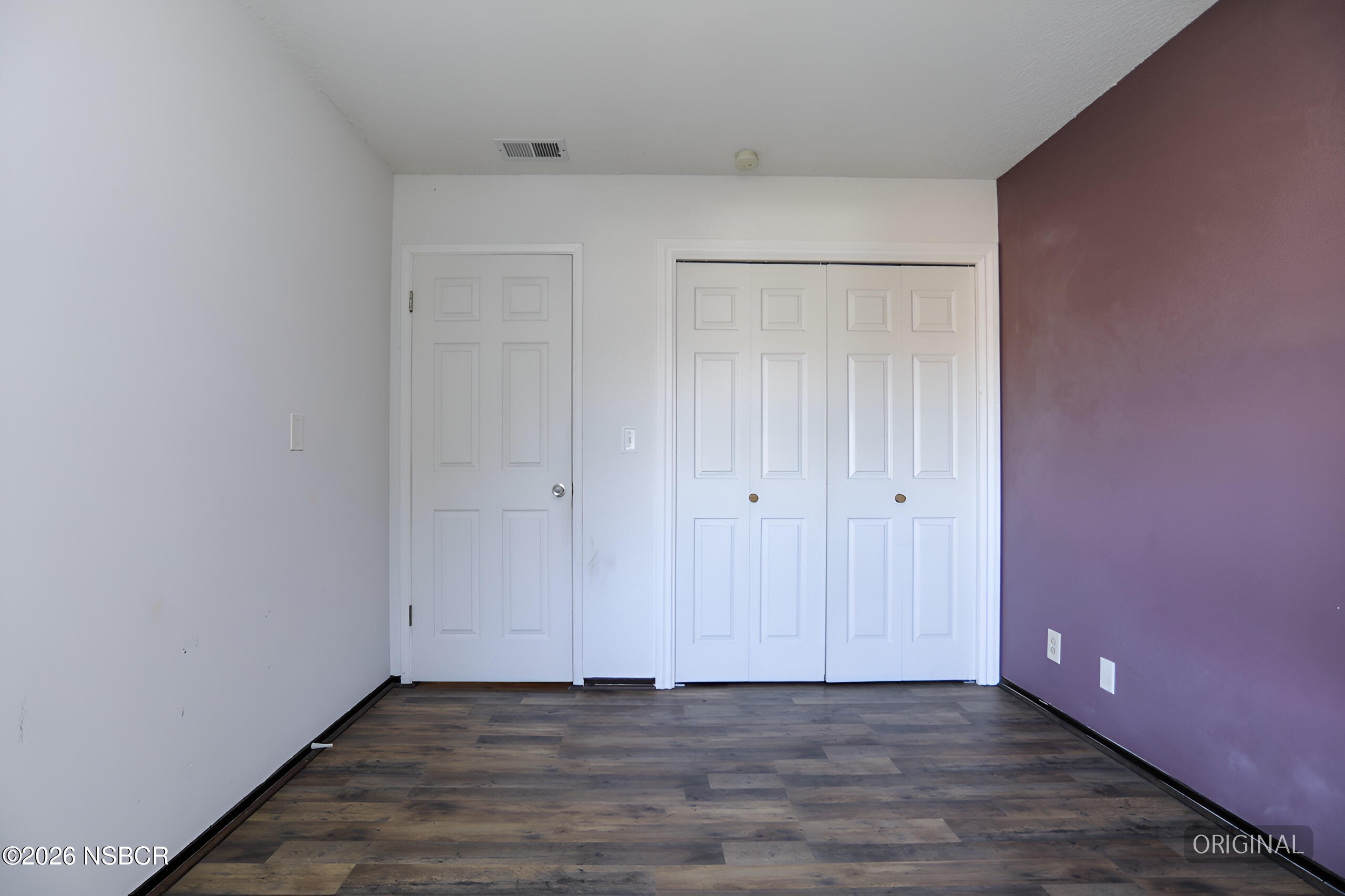 1321 North Bradley Road, Unit 14 Santa Maria, CA 93454 - Photo 25 of 30 a view of an empty room with wooden floor
