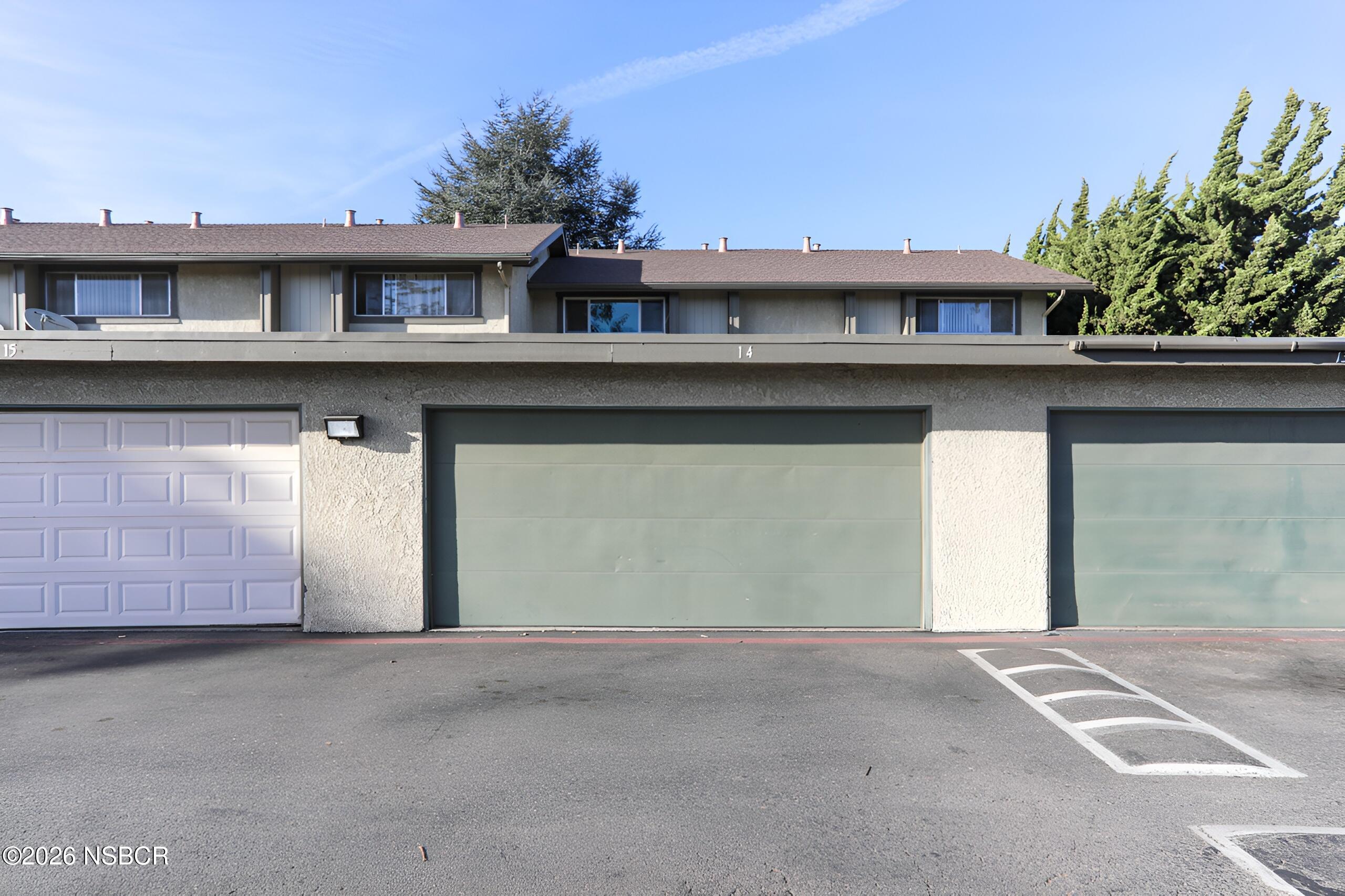 1321 North Bradley Road, Unit 14 Santa Maria, CA 93454 - Photo 28 of 30 a view of a white building with large windows