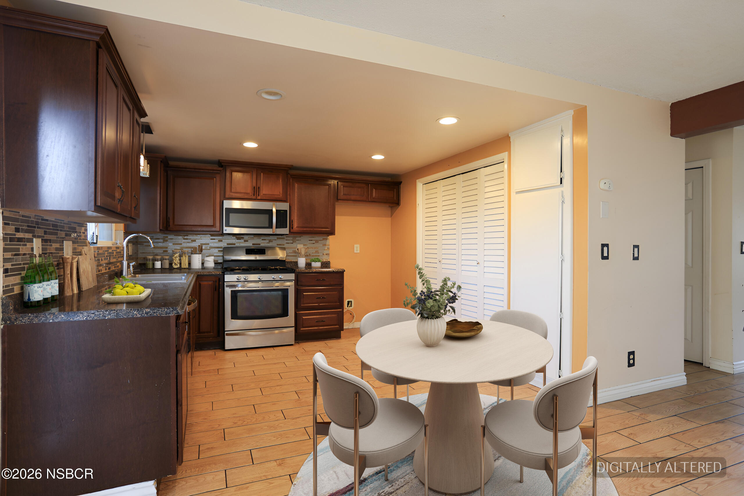 1321 North Bradley Road, Unit 14 Santa Maria, CA 93454 - Photo 7 of 30 a kitchen with stainless steel appliances a dining table and chairs