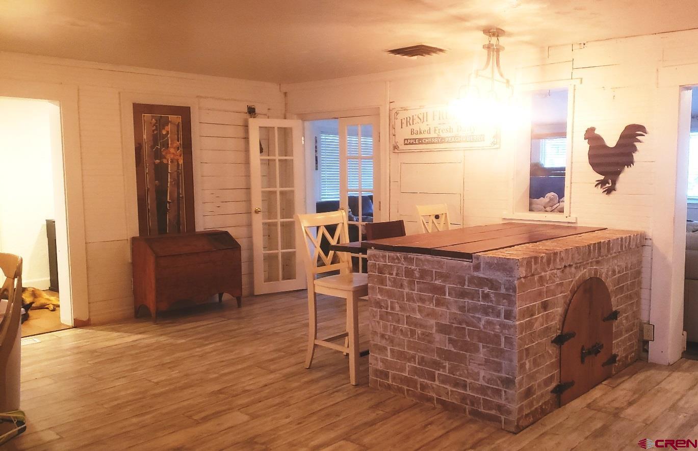 28236 Road H Cortez, CO 81321 - Photo 31 of 37 Large area with room for 2 large tables if desired, also former brick oven makes a great buffet.