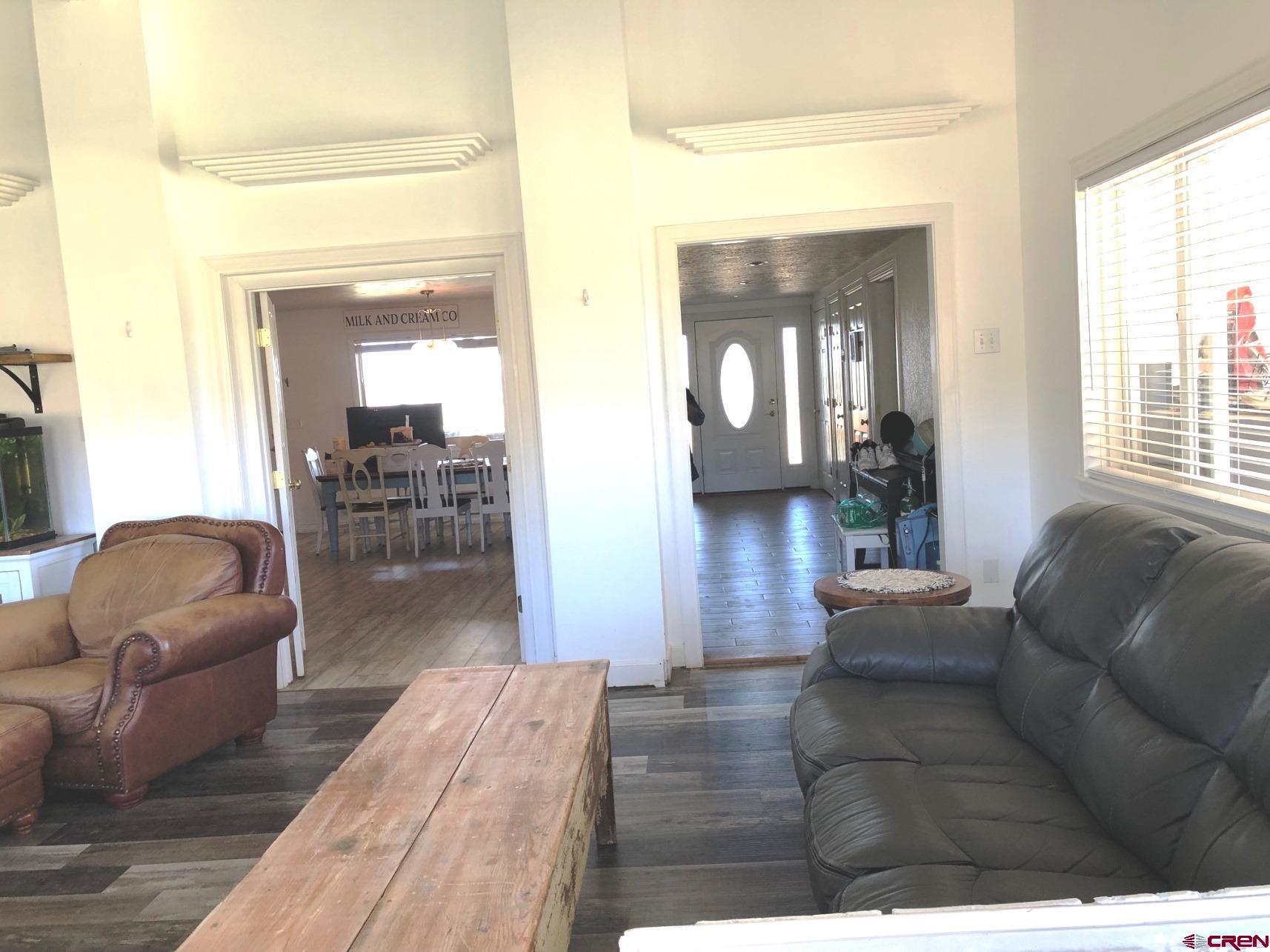 28236 Road H Cortez, CO 81321 - Photo 34 of 37 a living room with furniture and a large window