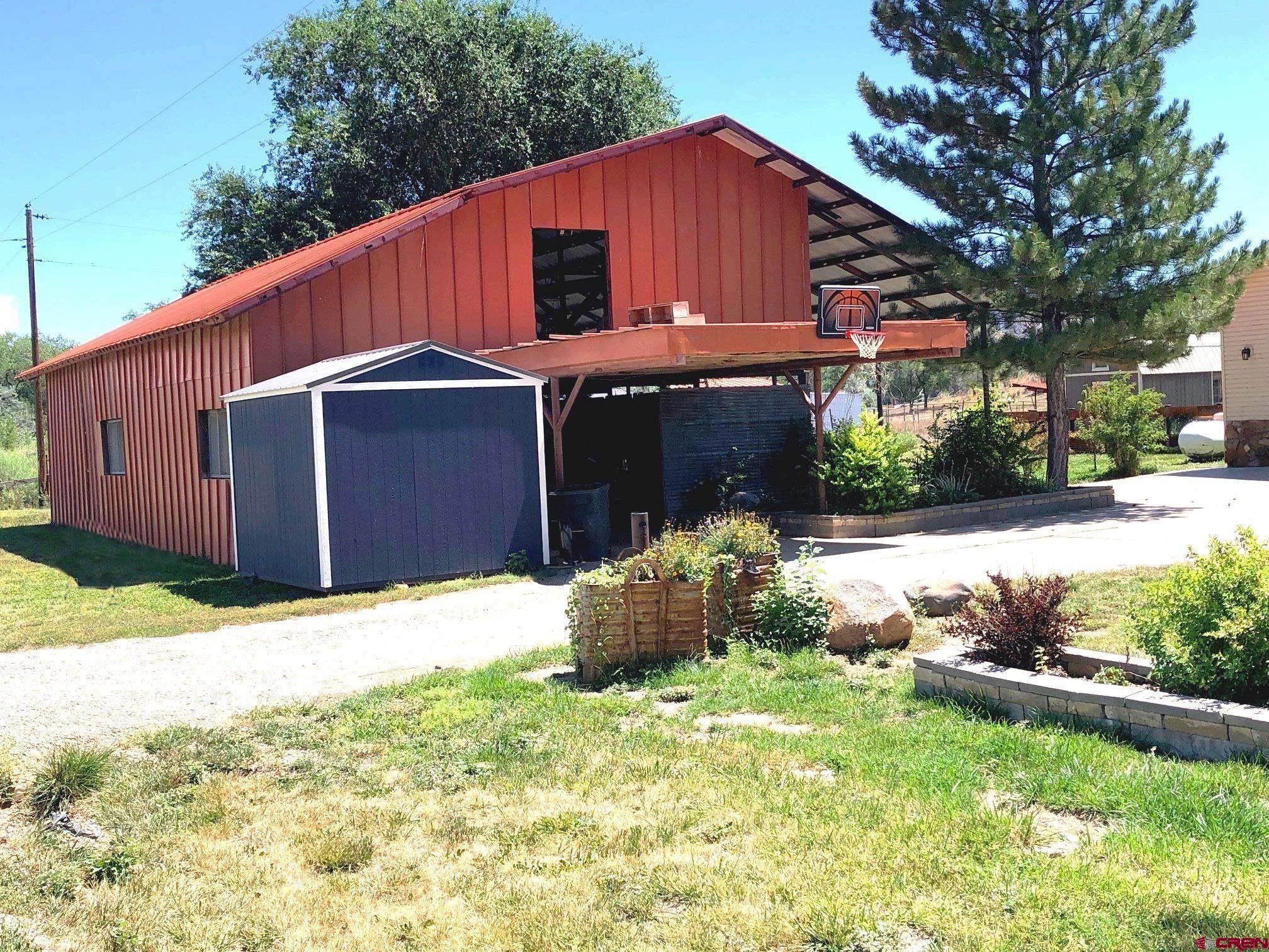 28236 Road H Cortez, CO 81321 - Photo 35 of 42 open barn--great for working on cars or livestock